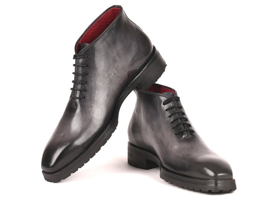 The Paul Parkman Ankle Boots, model 791GRY14, feature a gray burnished finish with a striking red interior lining. Displayed at an angle, these hand-painted leather boots for men offer a unique blend of style and craftsmanship.