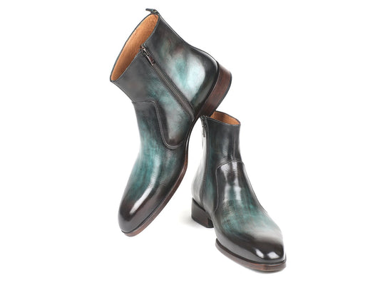 A pair of Paul Parkman Turquoise Burnished Side Zipper Boots - BT487TRQ, featuring shiny turquoise burnished leather, side zippers, and brown soles designed for men, stands upright against a white background.