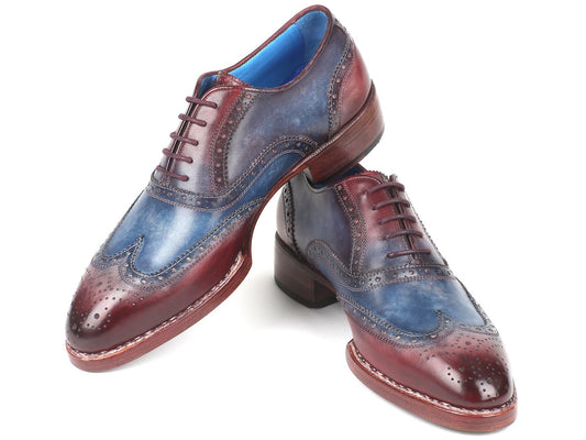 The Paul Parkman Goodyear Welted Two Tone Wingtip Oxfords, model 27LD77, feature hand-painted leather with a striking blue and Bordeaux gradient, brogue detailing, and wooden soles.