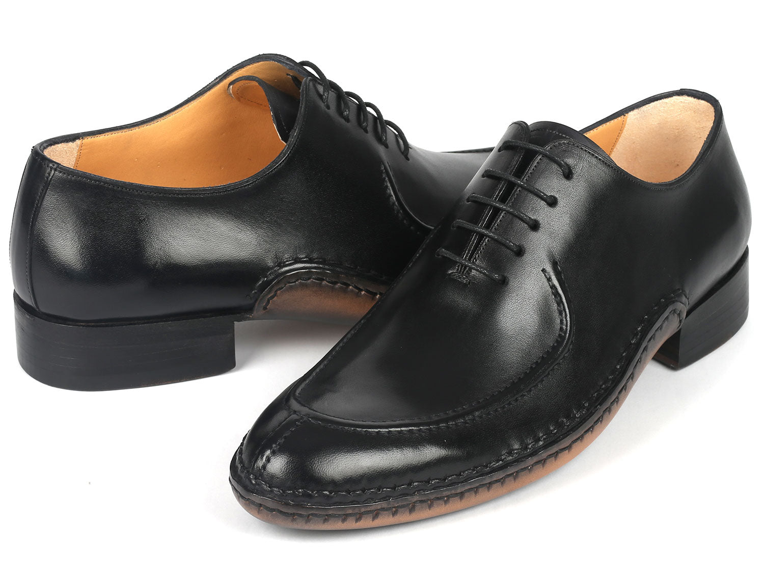 The Paul Parkman Opanka Stitched Men's Split-Toe Black Leather Oxford Shoes - 054-BLK, from the brand Paul Parkman, are crafted from hand-painted black leather and feature elegant laces, displayed against a pristine white background.