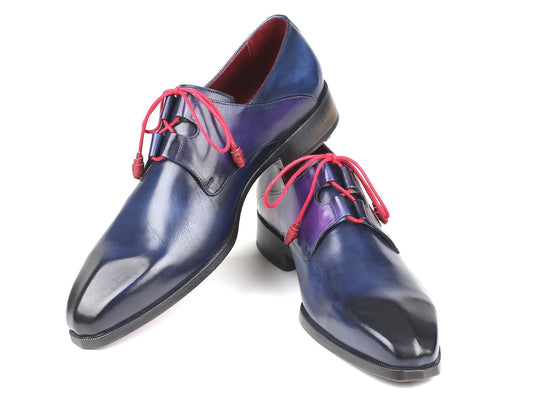The Paul Parkman Ghillie Lacing Blue Dress Shoes - GT511BLU, crafted from hand-painted calfskin leather and featuring striking red laces, are displayed against a pristine white background.