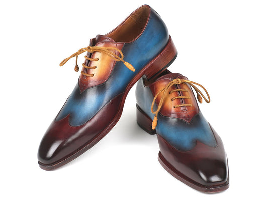 The Paul Parkman Three Tone Wingtip Oxfords in Bordeaux Blue & Camel - AL3249TU are a sophisticated pair of oxfords made from hand-painted leather, showcasing laces and a glossy finish.