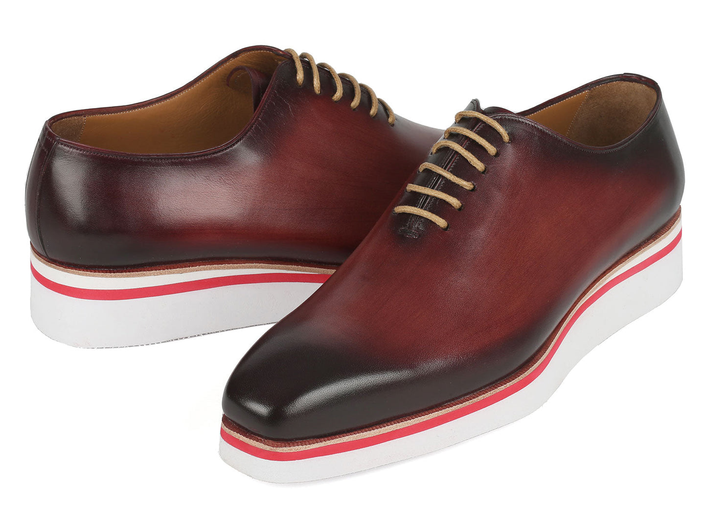 The Paul Parkman Smart Casual Wholecut Oxfords Bordeaux - 191-BRD are exquisite brown leather dress shoes, featuring unique hand-painted white and red striped soles and complemented by beige laces. These shoes are ideal for adding a touch of distinction to your smart casual collection.