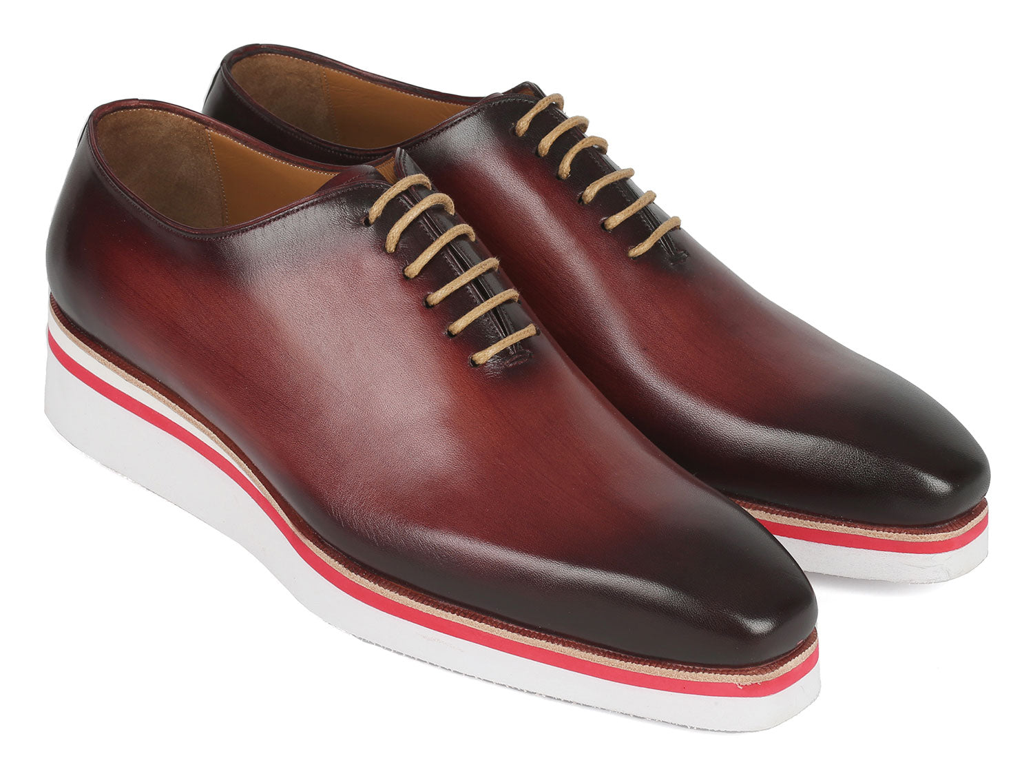 The Paul Parkman Smart Casual Wholecut Oxfords Bordeaux - 191-BRD are exquisite brown leather dress shoes, featuring unique hand-painted white and red striped soles and complemented by beige laces. These shoes are ideal for adding a touch of distinction to your smart casual collection.