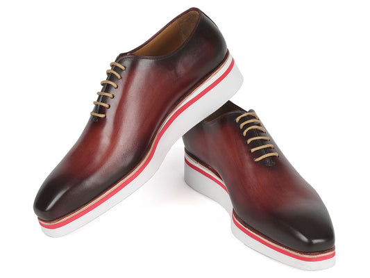 The Paul Parkman Smart Casual Wholecut Oxfords Bordeaux - 191-BRD are exquisite brown leather dress shoes, featuring unique hand-painted white and red striped soles and complemented by beige laces. These shoes are ideal for adding a touch of distinction to your smart casual collection.