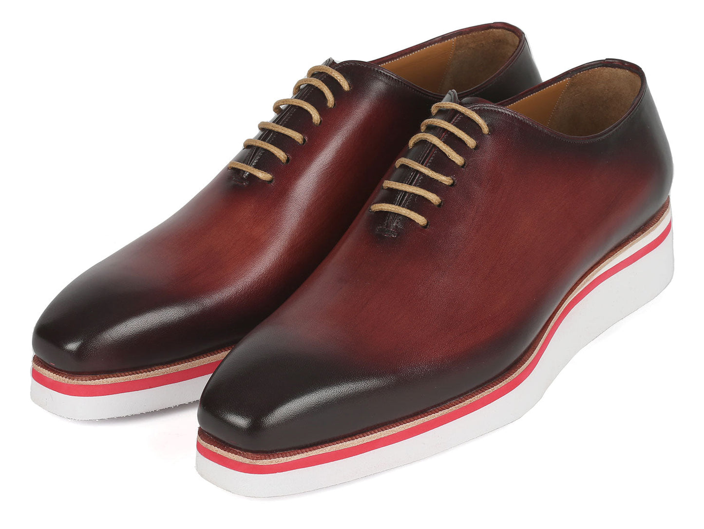 The Paul Parkman Smart Casual Wholecut Oxfords Bordeaux - 191-BRD are exquisite brown leather dress shoes, featuring unique hand-painted white and red striped soles and complemented by beige laces. These shoes are ideal for adding a touch of distinction to your smart casual collection.