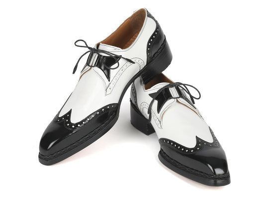 Introducing the Paul Parkman Norwegian Welted Wingtip Dress Shoes in Black & White (Model 8505-BNW), crafted with a sophisticated wingtip derby design. These elegant shoes feature bow laces, intricate decorative perforations, and are completed with a luxurious handcrafted leather sole.