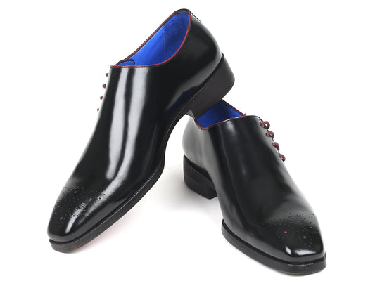 Introducing the Paul Parkman Side Lace Oxfords in Black Polished Leather (model 981X65), a bespoke-quality creation. These oxfords feature a glossy black finish, blue interior lining, and maroon laces, along with distinctive decorative perforations on the toe caps that exude sophisticated elegance.