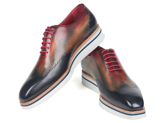 Experience the Paul Parkman Smart Casual Wingtip Oxfords Multicolor (187-MIX-NVY), expertly crafted with hand-painted, multicolored leather. These polished shoes feature striking red laces and blue-striped soles, making them perfect for smart casual occasions. Brought to you by the renowned brand, Paul Parkman.