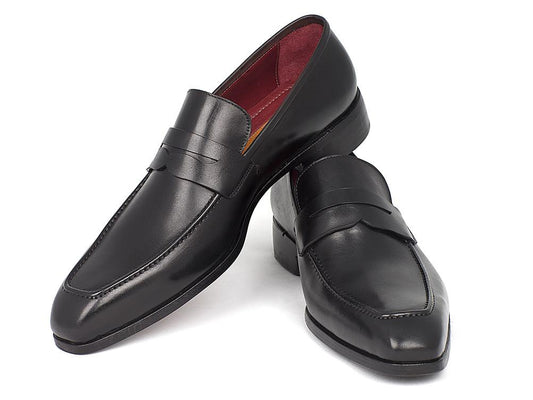 The Paul Parkman Penny Loafer Black Calfskin - 10BLK29, crafted by Paul Parkman, is a pair of black leather loafers with a polished finish. These men's slip-on shoes are hand-painted for a unique touch and feature a classic penny strap design with a square toe, positioned upright on a white background.