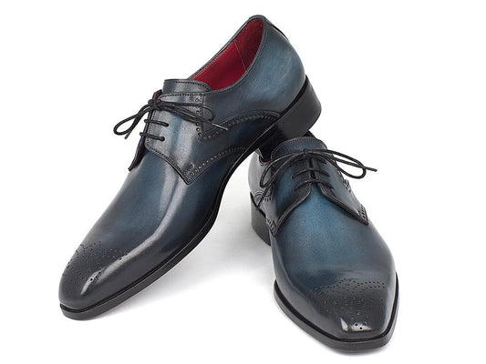 Paul Parkman's Navy & Blue Medallion Toe Derby Shoes (Model: 6584-NAVY) are a sophisticated choice for men, crafted from polished hand-painted leather in black and blue hues. These shoes feature laces and decorative medallion perforations on the toe caps.