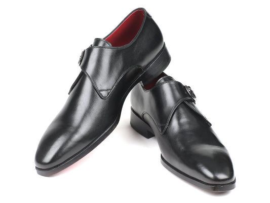 Introducing the Paul Parkman Black Leather Single Monkstraps - 011BLK54: a sleek pair of shiny black monkstrap shoes crafted from premium calfskin leather, featuring a striking red interior lining and stylish decorative buckles adorning the pointed toes.