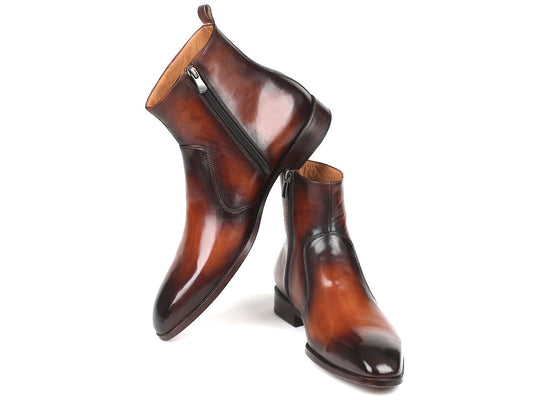 A pair of Paul Parkman Brown Burnished Side Zipper Boots (model BT486-BRW) featuring polished brown burnished leather and a natural leather sole, with one boot standing upright while the other leans against it.