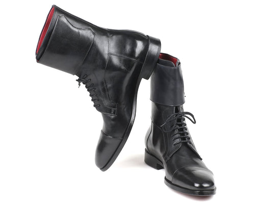 Product Description: The Paul Parkman High Boots Black Calfskin - F555-BLK, by Paul Parkman, features two exquisite black calfskin leather lace-up boots. One boot stands upright while the other leans slightly, highlighting their elegant and sleek design. These men's high boots are made-to-order to ensure a perfect fit and impeccable style.