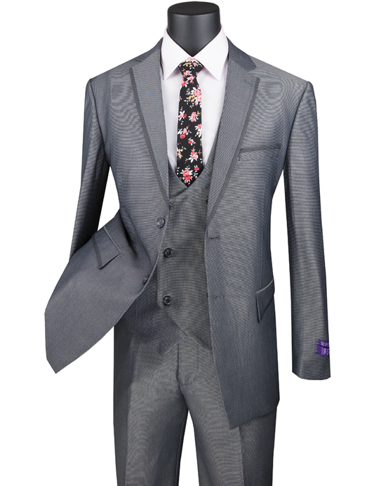 The Vinci Suits Modern Fit 3 Piece Suit Birdseye Pattern with Contrast Trim in charcoal, displayed on a mannequin, features a floral tie and white shirt. Its subtle birdseye pattern enhances its classic appeal, while wrinkle-resistant fabric ensures it stays crisp all day.
