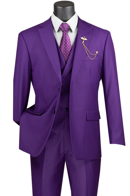 The Vinci Suits Modern Fit 3-Piece Suit in Purple exudes sophistication with its luxurious wool feel. A polka dot tie and gold lapel pin enhance this elegant ensemble, perfect for any discerning wardrobe.