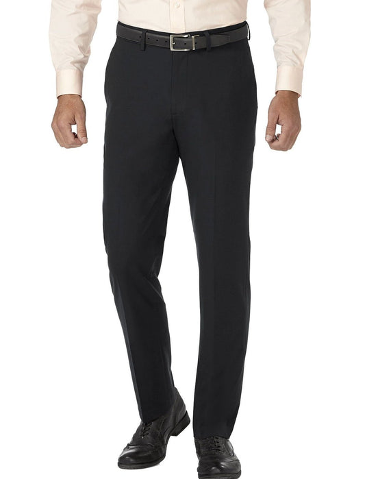 A person dressed in Vinci Suits' Slim Fit Flat Front Pre-Hemmed Dress Pants (Black) OS-900, complemented by a crisp white shirt, a sleek black belt, and polished black shoes.
