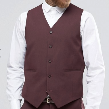 A man wears a Vinci Suits Slim Fit Single Breasted 5 Button Vest (Burgundy) OV-900 over a crisp white shirt. His beard is visible, but his face is obscured.