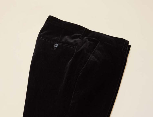 Inserch Velvet Pants P502-01 Black, featuring a modern fit and a back-buttoned pocket, are displayed on a light background.