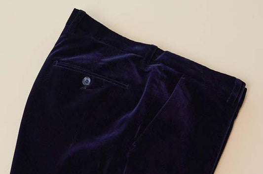 A pair of Inserch Velvet Pants P502-11 in a rich navy blue, crafted from a poly nylon blend and featuring a modern fit with a single back pocket and button closure, displayed on a light background.