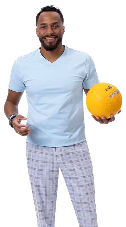 A man wearing EJ Samuel Sky Blue Plaid Pants PL129 is holding a yellow volleyball, smiling.