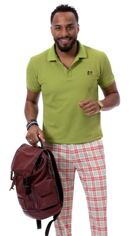 A man stands smiling, showcasing his modern fit with a green polo shirt and stylish EJ Samuel Green Plaid Pants PL136, holding a brown backpack.