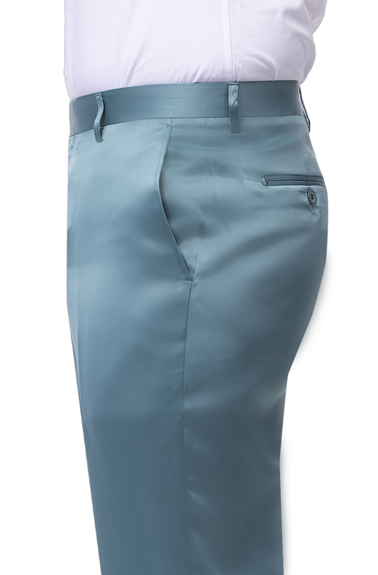 This side view showcases someone wearing EJ SAMUEL's EJ Samuel Jade Satin Pants PS02 in light blue satin, paired with a tucked-in white shirt. These stylish slim fit pants include a buttoned back pocket and belt loops.
