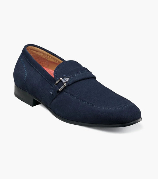 The Stacy Adams Quillan Moc Toe Ornament Slip On in navy suede features a slip-on moc toe design, decorative metal bit, low black heel, and enhanced comfort with the RedZone footbed.