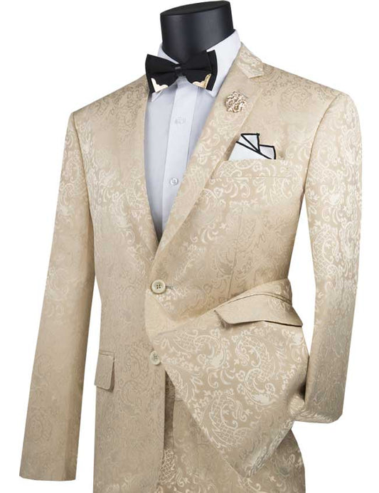 The Vinci Suits Slim Fit 2 Piece Single Breasted Suit in Beige (S2F-1) features a luxurious wool feel, paired with a gold lapel pin, white shirt, black bow tie, and folded pocket square.