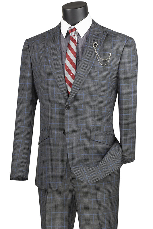 The mannequin sports a Vinci Suits Slim Fit Suit with Peak Lapel and Stretch Armhole in charcoal, paired with a white shirt, red and white striped tie, and a silver chain lapel pin.