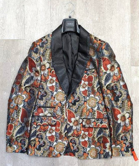 The Inserch Floral Jacquard Shawl Collar Blazer BL201-30 Red by Inserch, characterized by its colorful and slim fit with an intricate floral and paisley pattern, features a black satin jacquard shawl collar and is displayed on a hanger against a light wood background.