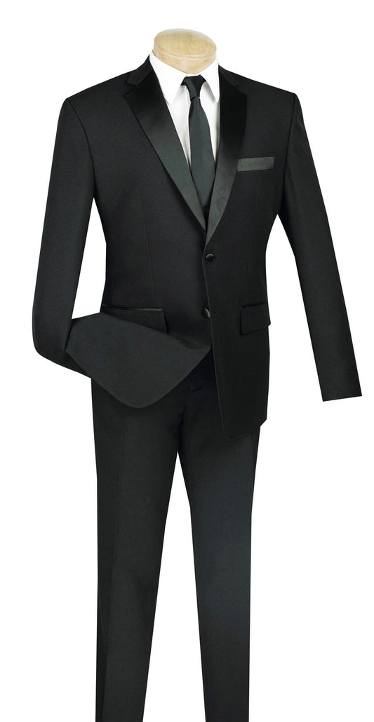 Displayed on a mannequin, the Vinci Suits Slim Fit 2 Piece Tuxedo (Black) with satin lapels exudes elegance. Paired with a crisp white shirt and sleek black tie, this single-breasted design epitomizes timeless style.