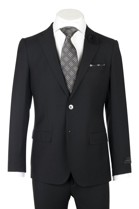 The display mannequin showcases the Porto Black, Slim Fit, Pure Wool Suit by Tiglio Luxe TIG1001, beautifully paired with a crisp white dress shirt, a patterned gray tie, and a sophisticated black lapel flower—exemplifying classic European styling in men's clothing.