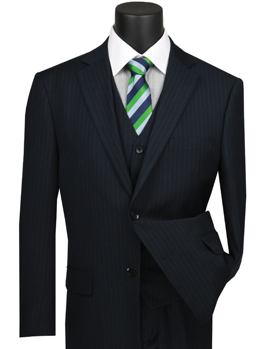 A navy tone-on-tone stripe three-piece suit by Vinci Suits with a white shirt and green-striped tie is displayed on a mannequin, highlighting timeless elegance in a regular fit.