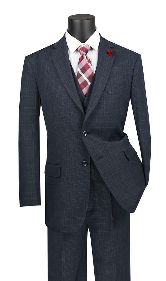 The mannequin showcases a Vinci Suits Regular Fit Glen Plaid 3 Piece Suit (Blue) V2RW-15, styled with a classic white shirt and red plaid tie. A bold red lapel pin adds a touch of flair to the ensemble.