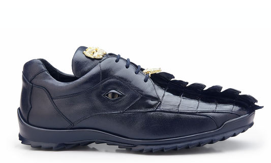 Introducing the Belvedere Vasco, a Navy sneaker made with genuine Hornback Crocodile and soft calf leather. This stylish shoe showcases a unique scale-like pattern with gold accents on both the top and front, and is completed with a cushioned insole for enhanced comfort.