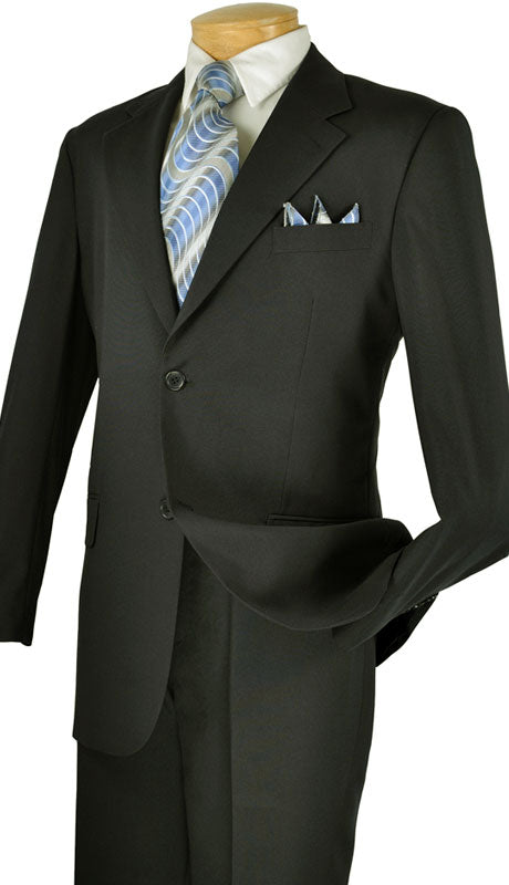 A Vinci Suits mannequin displays the Single Breasted Poplin Dacron Suit (Black) 2PP with flat front pants, complemented by a light blue tie and pocket square against a crisp white shirt, as one hand rests casually in the pocket.