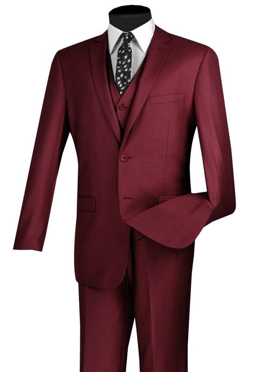 The Vinci Suits Slim Fit 3 Piece 2 Button Suit in burgundy (SV2900) is elegantly showcased with a black-and-white patterned tie and crisp white shirt.
