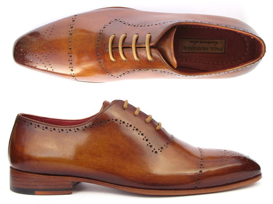 The Paul Parkman Light Brown Classic Brogues - ZLS32CML, crafted by Paul Parkman, showcase brogue detailing and laces in classic oxford style, with side and top views highlighting their design. Each pair is made-to-order, providing a unique touch of craftsmanship.
