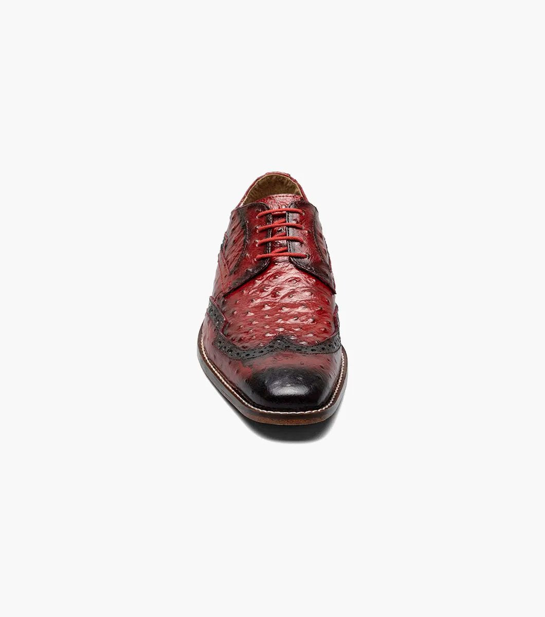 The Stacy Adams GENNARO Wingtip Oxford in red (model 25537-600) showcases an exquisite design. With its genuine leather outsole and elegant brogue features, this sophisticated dress shoe offers a textured surface with decorative perforations, a lace-up closure, and a low heel for those who appreciate timeless style.
