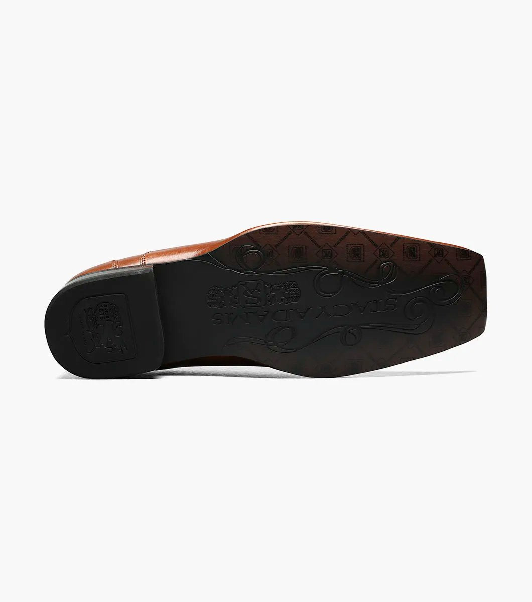 The Stacy Adams Templin Bike Toe Loafer in cognac (24507-221) features brown genuine leather, a pointed toe, low black heel, and decorative stitching—a classic slip-on dress shoe by STACY ADAMS.