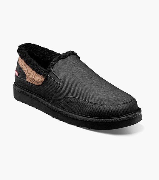Stacy Adams COZE Moc Toe Slip On in Black Multi, featuring a textured design at the back, cushioned footbed, and fuzzy faux shearling inner lining against a white backdrop.