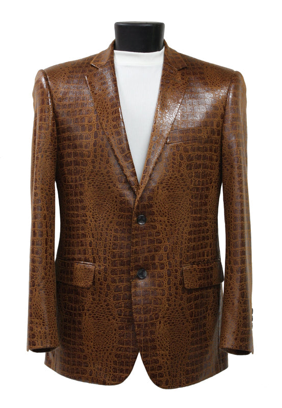 The Bassiri Blazer J1041-Cognac, by Bassiri, in a luxurious cognac crocodile pattern, is beautifully displayed on a black mannequin torso and complemented with a chic white turtleneck.